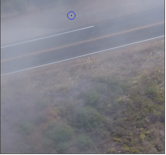  This image was taken in dense fog, obscuring the ground. 