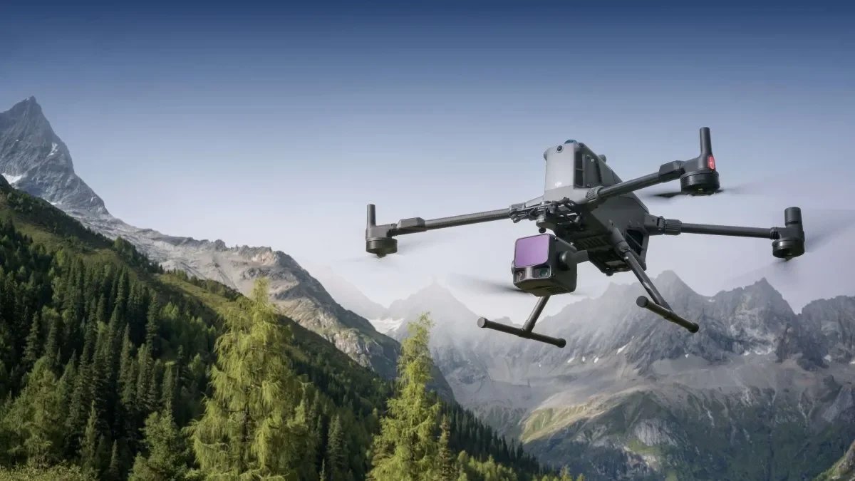 DJI Matrice 400 with Zenmuse L3 LiDAR sensor flying over mountain terrain.